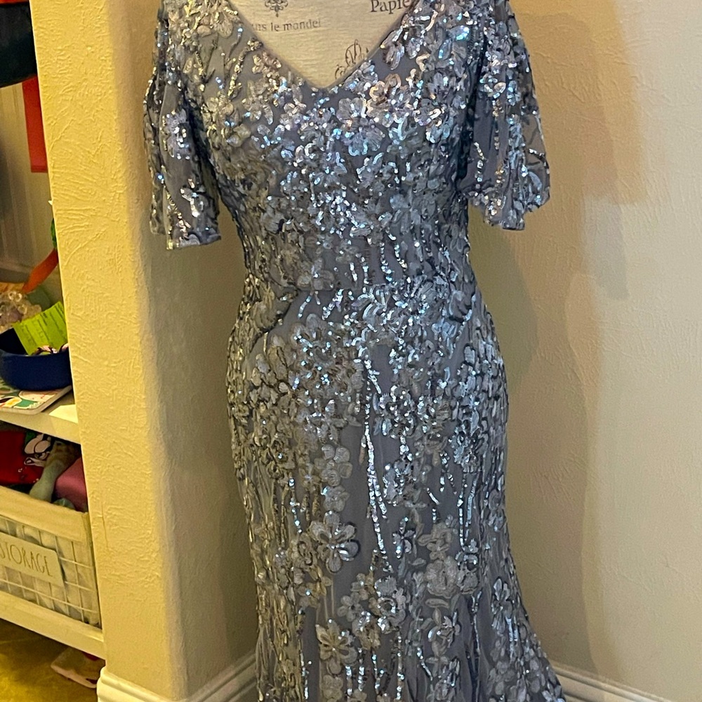Floor-length fully sequined evening gown.